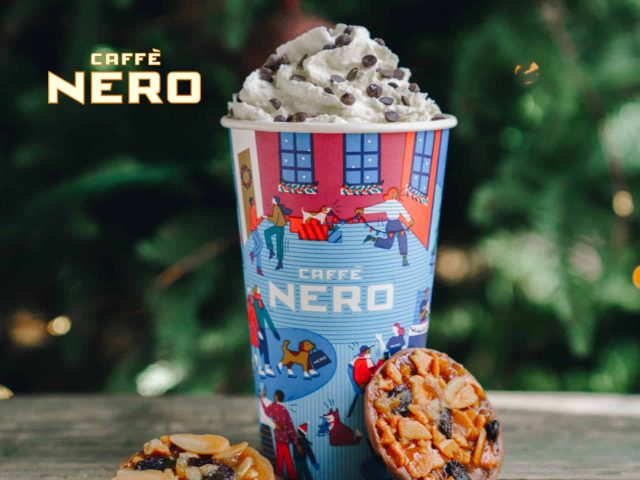 Caffè Nero Black coffee cup with crema, latte art, on a dark background. Coffee, espresso, caffeine, coffee shop, dark roast.