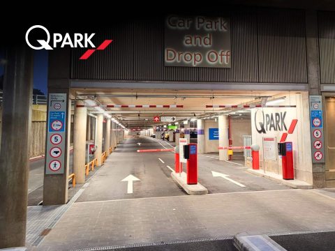 Q-Park parking garage exterior. Modern parking facility with ample spaces. Parking solutions in [City Name].