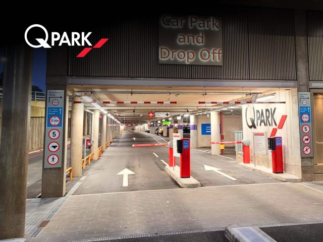 Q-Park parking garage exterior. Modern parking facility with ample spaces. Parking solutions in [City Name].