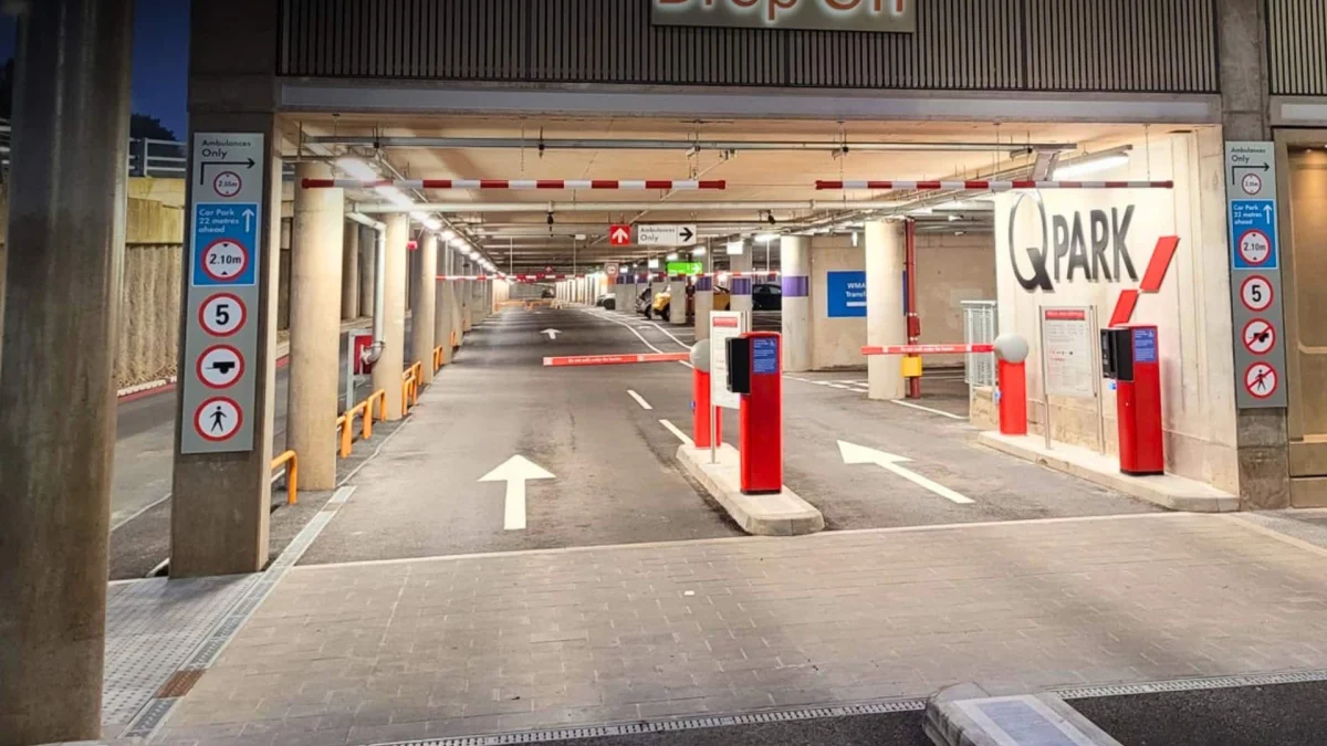 Q-Park multi-storey car park facility featuring modern signage and secure parking bays for city centre travellers.