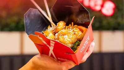 Chopstix Noodle Bar takeaway meal featuring delicious stir-fry noodles and sides in branded packaging for quick dining.