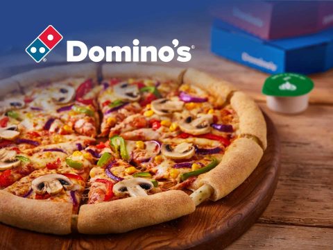 Domino's Pizza promotional cover featuring a variety of pizzas and a special offer. Delicious pizza delivery and carryout available.