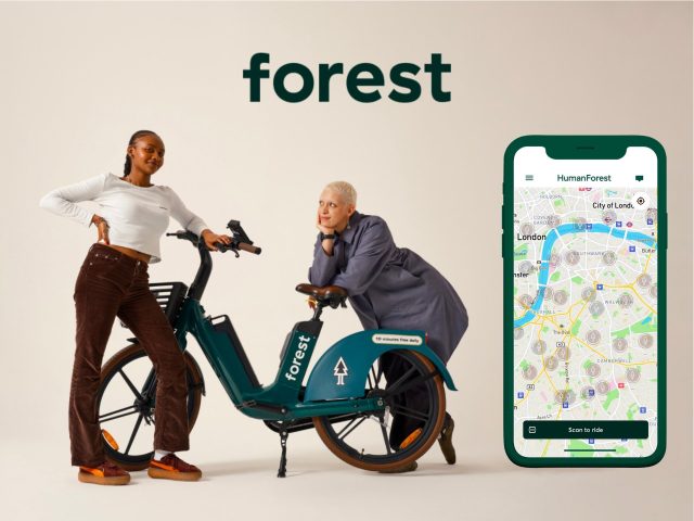 Person riding a mountain bike through a lush green forest, scenic landscape, outdoor adventure, cycling, nature photography, hiking trail, forest path.