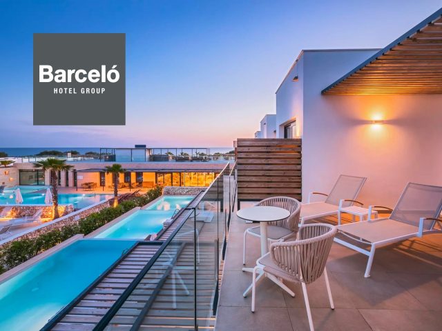 Barceló Hotel Barcelona - Stunning view of hotel exterior with modern architecture. Barcelona city skyline in background.