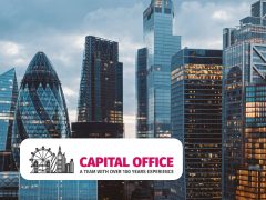 Modern office space with large windows and city view. Corporate office, business, workspace, office design, contemporary architecture.