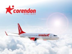 Corendon Airlines promotional cover featuring a vibrant sunset and airplane, highlighting flight deals and travel offers.