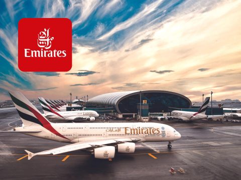 Emirates airline cover featuring stunning aerial view, travel, vacation, flight, luxury, global destinations, travel deals, savings.
