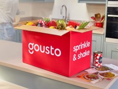 Gousto meal kit box with fresh ingredients, ready to cook. Delicious recipes for home cooking.