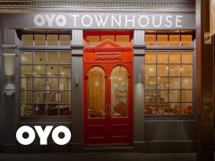 Stylish hotel room interior with comfortable beds, modern decor, and a welcoming atmosphere. Perfect for a relaxing stay. Oyo Rooms.