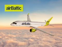 AirBaltic airplane in flight, blue sky background, travel, airline, flight, air travel, Baltic airlines, passenger plane.