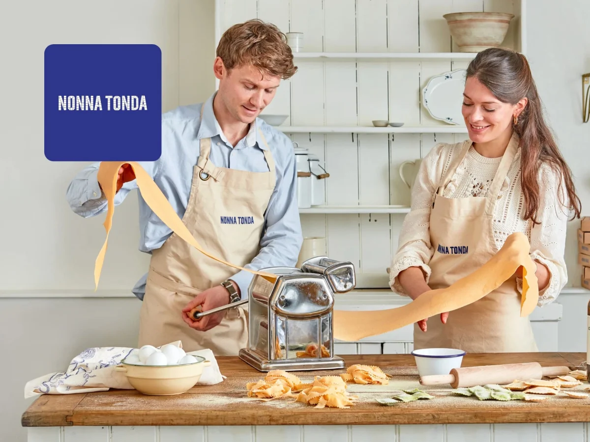 Freshly prepared Nonna Tonda pasta dishes arranged on a wooden table, showcasing authentic Italian meal delivery service.