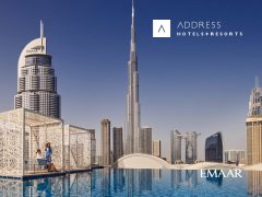 Address Hotels & Resorts: Luxury hotel exterior at dusk, showcasing modern architecture and inviting ambiance. Perfect for a relaxing getaway.