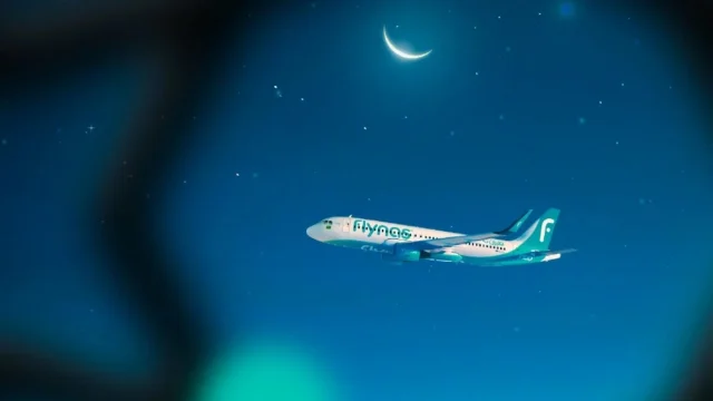Flynas Airlines aircraft parked at the airport terminal, representing budget-friendly air travel and flight bookings.