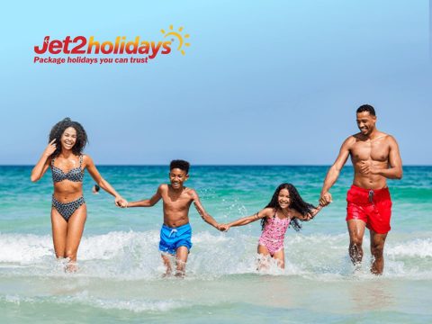 Jet2holidays cover image: Sunny beach holiday with turquoise water and palm trees. Book your package holiday with Jet2.com for great deals!