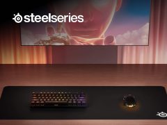 SteelSeries gaming headset and mouse on desk, perfect for esports and PC gaming. Shop SteelSeries for top gaming gear deals.