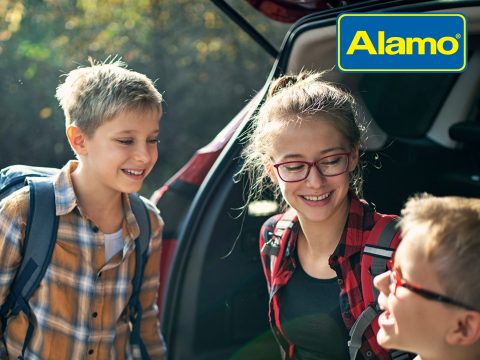 Alamo UK car rental cover image featuring a family and a rental car, highlighting deals and savings on UK car hire.