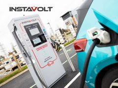 InstaVolt electric vehicle charging station with a car plugged in. Fast EV charging for electric cars. Find a charging point near you.