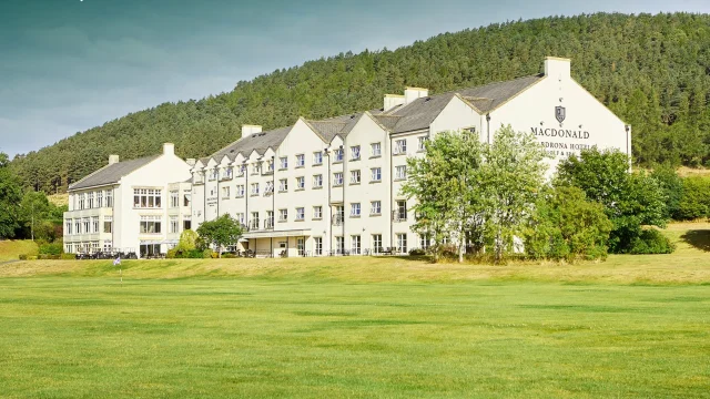 Luxury Macdonald Hotels and Resorts exterior view featuring elegant architecture and landscaped gardens in the UK.