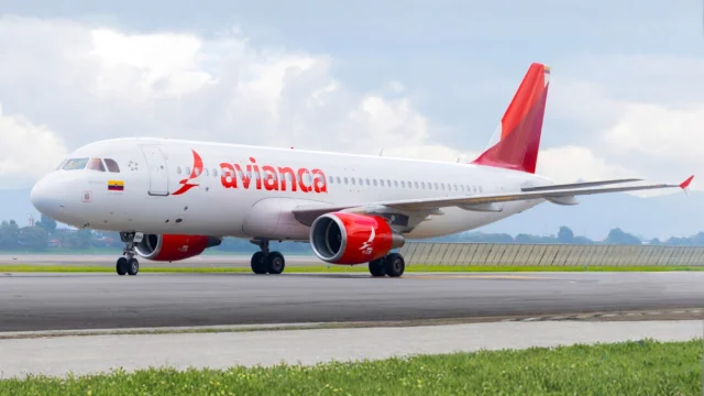 Avianca Airlines aircraft flying above the clouds, representing premium travel and flight booking deals.
