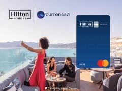 Hilton Honors Debit Card cover showcasing benefits & rewards. Earn points for stays, travel, & shopping. Apply now for exclusive deals!
