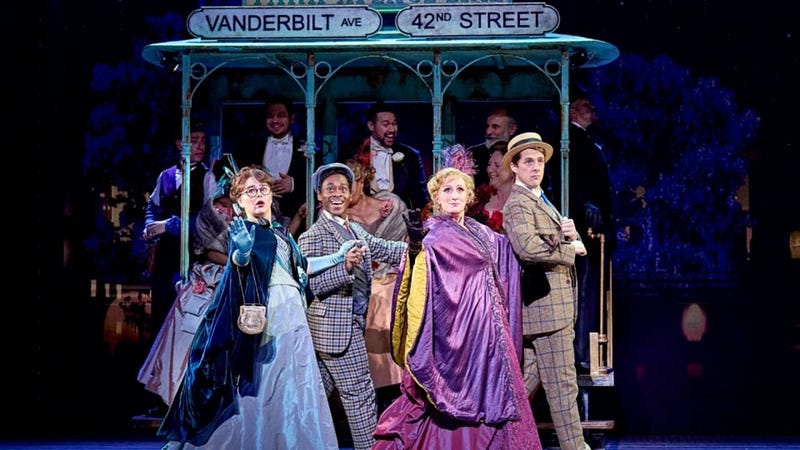 A vibrant scene from a West End musical in London. Bright costumes and energetic performers on stage. #LondonMusicals #WestEndShows #Theater #StagePerformance