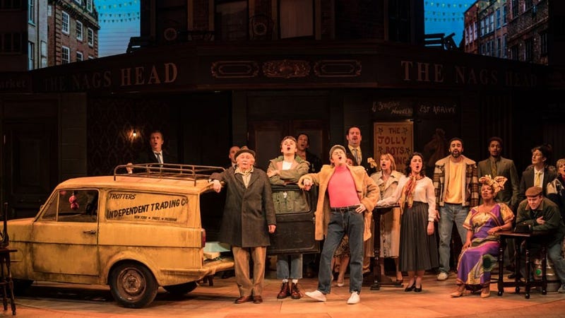 London's West End musicals - Top shows & cheap tickets. A vibrant scene with happy audience members.