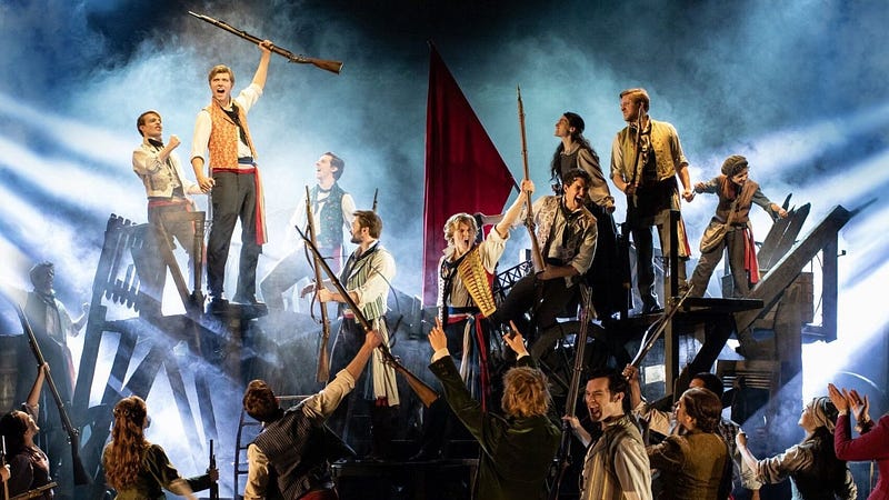 London's West End Musicals: A vibrant scene from a popular musical show. Discover top shows & cheap tickets for London theatre.