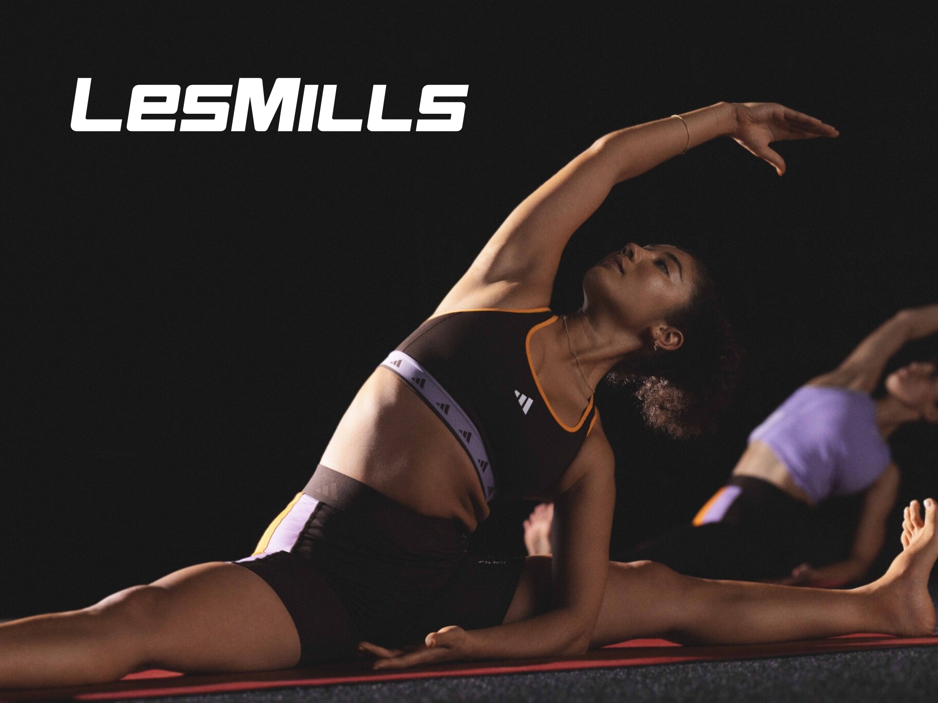 Les Mills brand cover image featuring group fitness workout training and gym exercise programs.