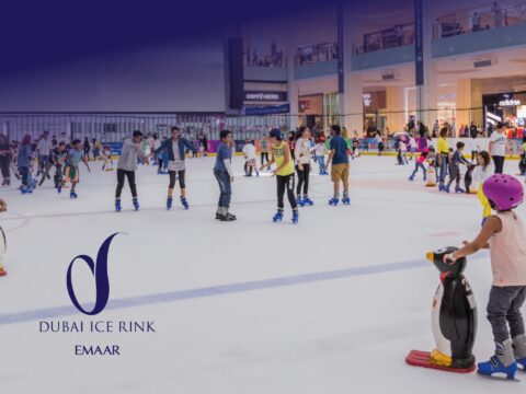 Skaters at the Olympic-sized Dubai Ice Rink in The Dubai Mall, a premier indoor leisure attraction by Emaar.