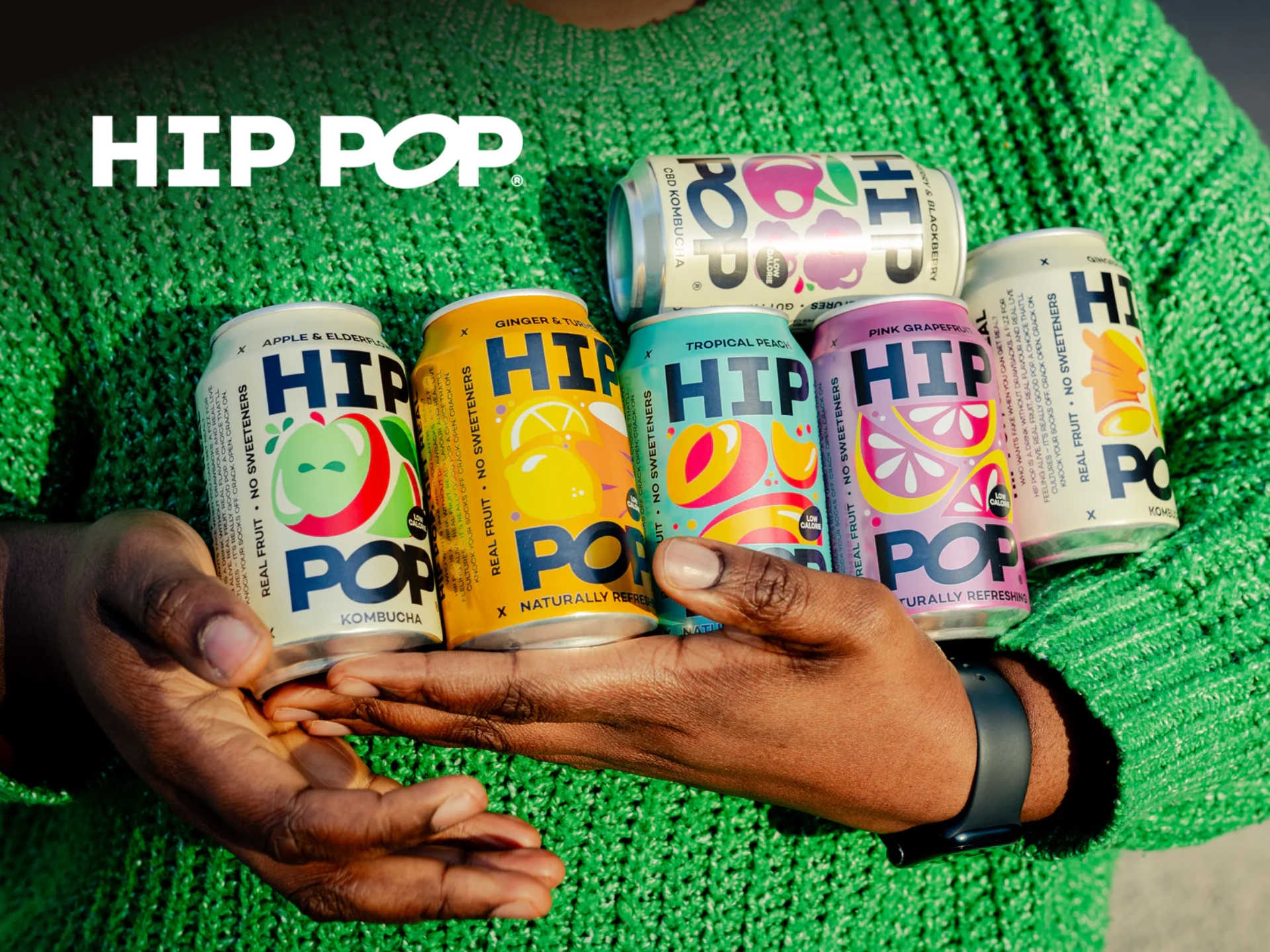 Hip Pop gut health drinks range featuring colourful kombucha and sparkling probiotic soda cans.