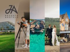 Scenic view of a JA Resorts & Hotels luxury holiday property with palm trees and a swimming pool.