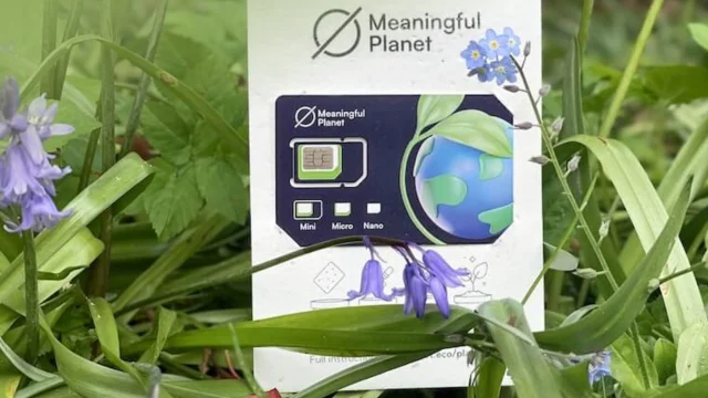 Meaningful Planet mobile phone displaying eco-friendly shopping deals and sustainable savings on a bright screen.