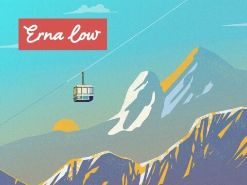 Scenic snow-covered mountain peaks and skiers on a piste, showcasing Erna Low ski holiday destinations in the Alps.