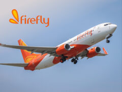 Firefly Airlines Firefly Airlines aircraft on the runway, showcasing travel deals and budget flights for holiday travellers.
