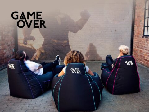 Game Over Store Game Over Store retail shop cover featuring retro video games, consoles, and gaming accessories for sale.