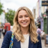 Happy Emily smiling, enjoying great shopping deals and savings. Discover exclusive offers and discounts online.