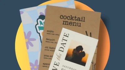 Professional instant printing services showing high-quality colour documents and marketing materials on a desk.