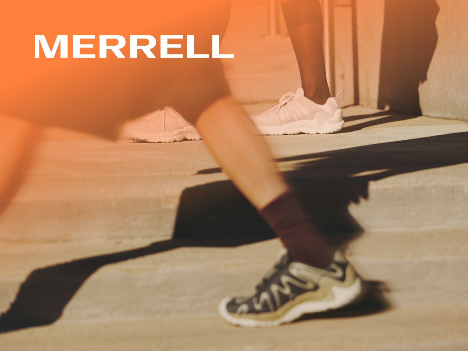 Merrell UK: Hikers in Merrell boots on a scenic mountain trail. Shop premium outdoor footwear, walking shoes & gear.