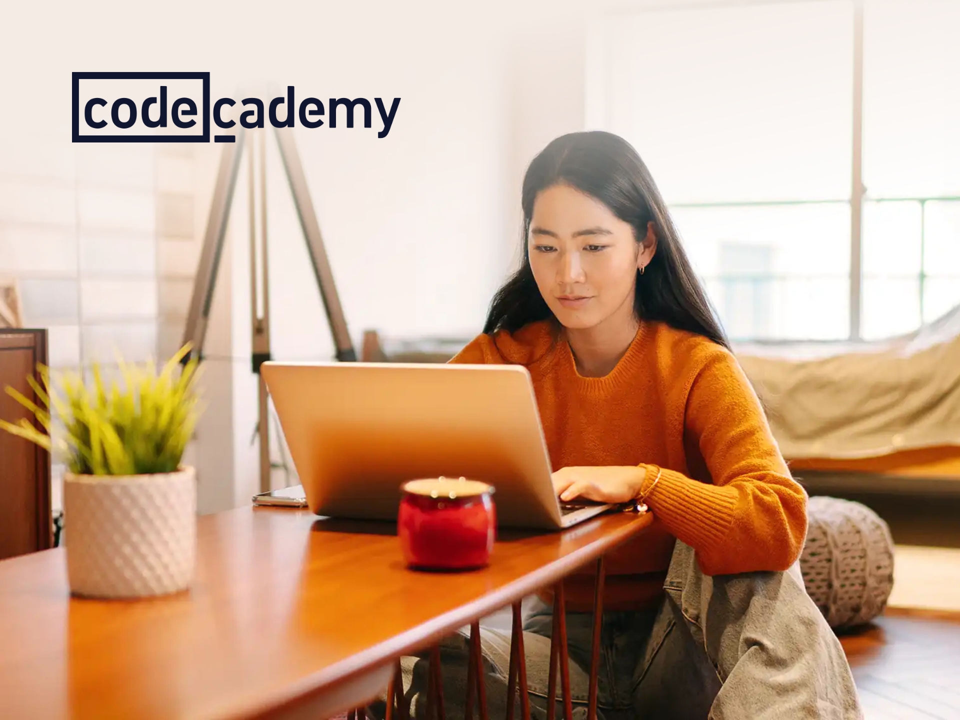 Codecademy brand logo with 'Codecademy' text in white on a dark blue background, promoting online coding courses.