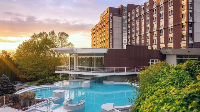 Luxury hotel room at Danubius Hotels featuring elegant decor and premium amenities for a relaxing stay in the city.