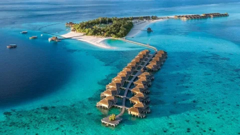 Luxury Constance Hotels and Resorts beach villa with turquoise ocean views, perfect for a relaxing tropical holiday.