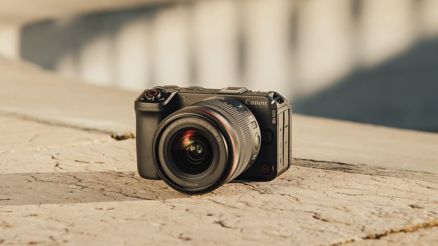 Canon camera displayed on a clean desk, representing professional photography equipment and exclusive brand offers.