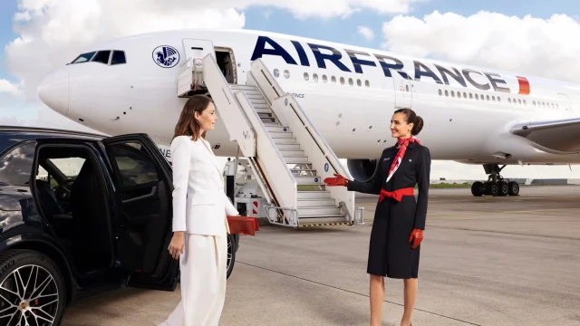 Air France UK aircraft flying above clouds, representing premium international travel and flight booking offers.
