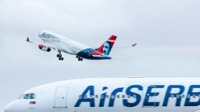 Air Serbia passenger aircraft flying above the clouds, representing premium travel and flight booking services.