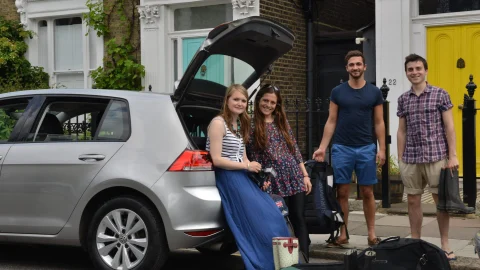 BlaBlaCar ride-sharing service showing a group of people travelling together in a car for affordable journeys.