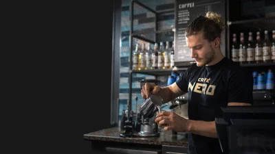 Caffè Nero storefront exterior with branding, ideal for coffee lovers seeking premium Italian-style coffee shop deals.