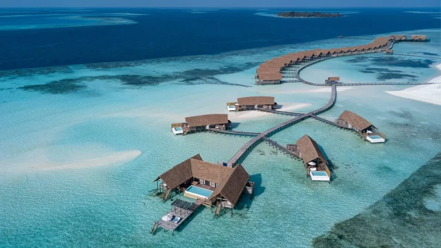 Luxury COMO Hotels and Resorts exterior view showcasing elegant architecture and serene holiday surroundings.