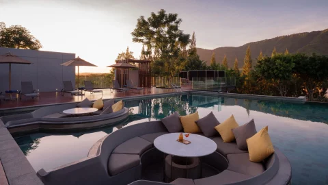 Luxury Dusit Hotels and Resorts exterior view featuring elegant architecture and tropical landscaping for travellers.