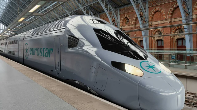 Eurostar high-speed train arriving at a London station, representing luxury rail travel and European city breaks.