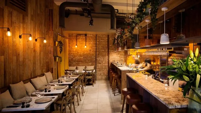 First Table dining experience featuring a gourmet meal at a restaurant table to represent exclusive dining deals.